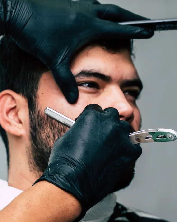 Straight-razor line-up on a male client's hairline