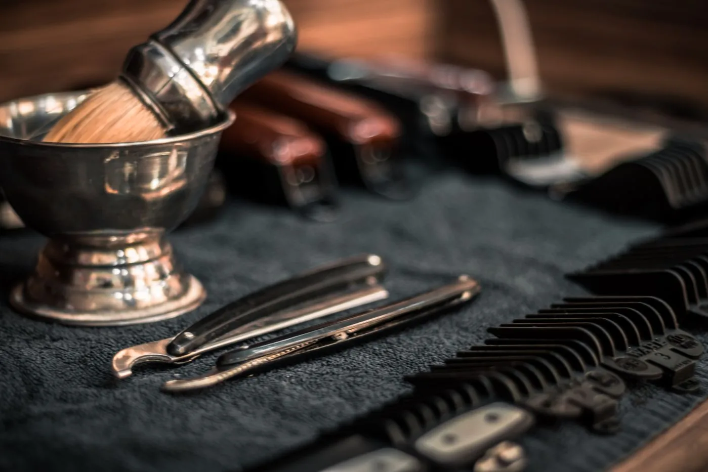 Barber tools laid out: clippers, scissors, and combs